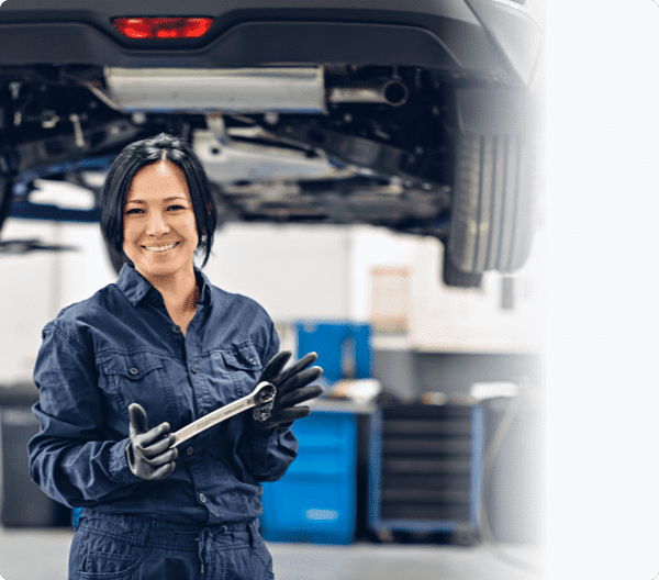 women mechanic holding a spanner